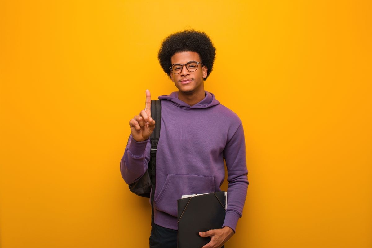 Young african american student man showing number one